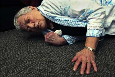 Woman who has fallen on the floor